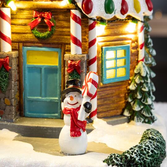 Glitzhome® 9" Lighted Christmas Candy Cane Inn Musical Resin Village with Timer
